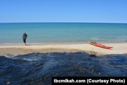 Sandy beaches are just one of the unique and diverse features at Pictured Rocks National Lakeshore in Michigan. While the water may look warm and inviting, it is extremely cold.