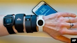 Fitness Trackers are wearable devices made to help you lose weight. But do they work? (AP Photo/Bebeto Matthews)