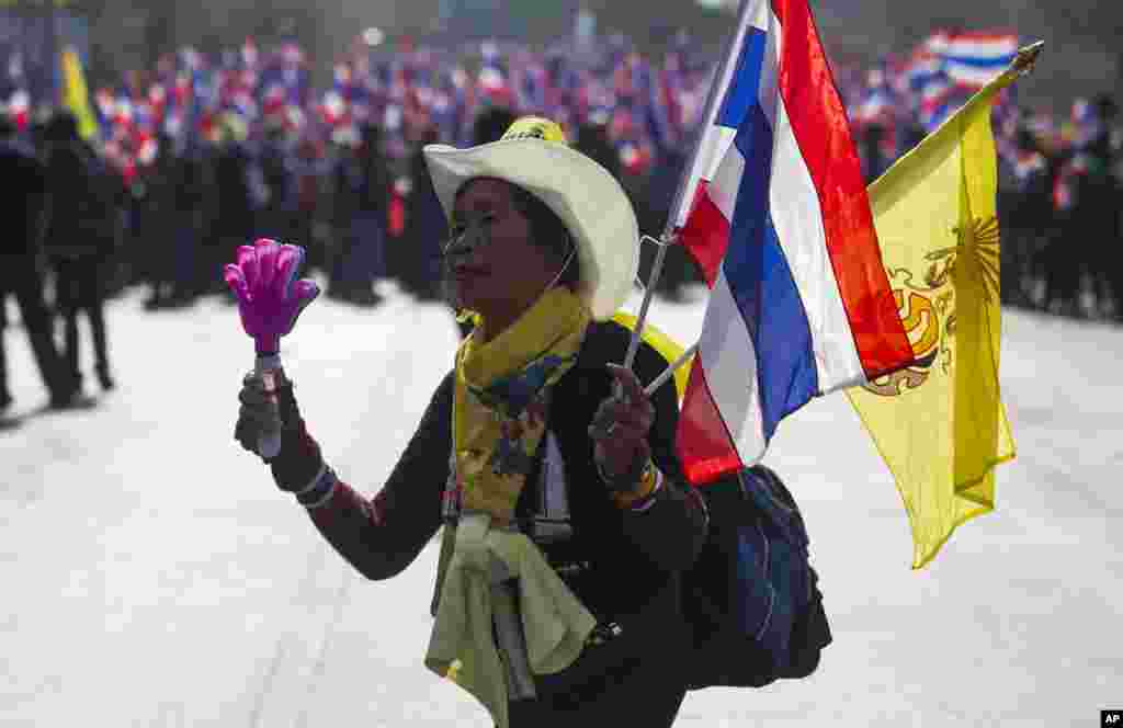 An anti-government protester leads the group during a march in Bangkok, Jan. 17, 2014. 