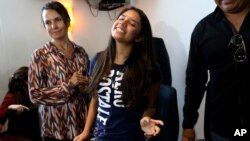 Alondra Luna Nunez, 14, smiles after attending a press conference upon her arrival to the Guanajuato International Airport in Silao, Mexico, April 22, 2015. 