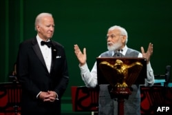 TOPSHOT - US President Joe Biden looks on as India's Prime Minister Narendra Modi speaks during an official State Dinner in honor of India's Prime Minister Narendra Modi, at the White House in Washington, DC, on June 22, 2023. (Photo by Stefani Reynolds /