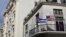 Cuban and U.S. flags are seen on the balcony of a restaurant in Havana, Cuba, March 19, 2016.  
