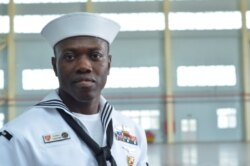 Ahmed Tabsoba, who grew up in Ghana, is now a U.S. citizen working for the U.S. Navy and back in his former home country as part of the conference. (Stacey Knott for VOA)