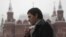 A man smokes along a street in central Moscow October 16, 2012. 