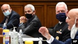 From left, Dr. Robert Redfield, director of the CDC, Director of the National Institute of Allergy and Infectious Diseases Dr. Anthony Fauci, and Adm. Brett Giroir of the U.S. Public Health Service listen at a hearing about COVID-19 on June 23, 2020.