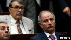 Turkey's Interior Minister Efkan Ala (R) attends a meeting at the Turkish parliament in Ankara, July 22, 2014.