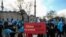 A protester from the Uyghur community living in Turkey, holds an anti-China placard during a protest in Istanbul, March 25, against the visit of China's FM Wang Yi to Turkey. 