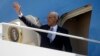 President Barack Obama waves as he boards Air Force One before his departure from Andrews Air Force Base, Md., May 2, 2013. 