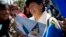 An Aymara indigenous woman holds a poster that reads in Spanish "Sea for Bolivia" during a rally in La Paz in support of Bolivia's bid for access to the Pacific Ocean, Sept. 24, 2015. 