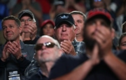 FILE - Members applaud as U.S. President Donald Trump addresses the National Rifle Association's (NRA) 148th annual meeting in Indianapolis, Indiana, April 26, 2019.