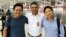 Myanmar photojournalists Minzayar Oo and Hkun Lat are seen with their lawyer in a photo posted on Twitter, Oct. 17, 2017.