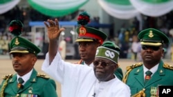 FILE - Nigeria's new President Bola Ahmed Tinubu, center, after taking an oath of office at a ceremony in Abuja, Nigeria, May 29, 2023. An appeals court in Nigeria was to rule Sept. 6, 2023, on whether Tinubu's election victory in February was legitimate, 