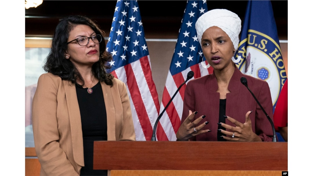 FILE - U.S. Representatives Rashida Tlaib, left, and Ilhan Omar participate in a news conference in Washington, July 15, 2019. In 2018, the two became the first Muslim women elected to U.S. Congress; they are credited for igniting a wave of Muslim political activism.