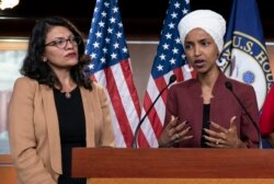 FILE - U.S. Congresswomen Ilhan Omar and Rashida Tlaib, both Democrats, are seen during a news conference at the Capitol, in Washington, July 15, 2019.