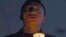 An exiled Tibetan participates in a candlelit vigil to show solidarity with self-immolators in Tibet in Dharmsala, India, Nov. 28, 2012.