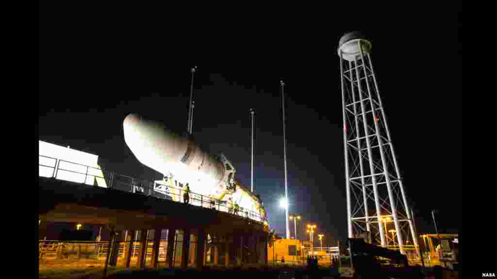 Orbital Sciences Corp. of Dulles, Virginia, USA, rolls out its Antares rocket and Cygnus spacecraft to the Mid-Atlantic Regional Spaceport Pad-0A at NASA&#39;s Wallops Flight Facility in Wallops Island, Virginia. The Antares is scheduled to launch Cygnus on Sept. 17 on a demonstration cargo resupply mission to the International Space Station.