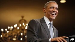 President Barack Obama laughs as the crowd sings "Happy Birthday" to him at the start of his remarks to the Young African Leaders Initiative event at the Omni Shoreham Hotel, in Washington, Aug. 3, 2016.