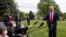 President Donald Trump speaks with reporters on the South Lawn of the White House, in Washington, May 14, 2020. 