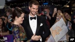 Actors Andrew Garfield, right, and Claire Foy pose for photographers upon arrival at the premiere of the film 'Breathe,' showing as part of the London Film Festival opening gala, in London, Oct. 4, 2017.