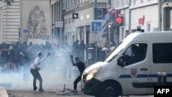 TOPSHOT - Protesters clash with CRS riot police in Marseille, southern France on June 30, 2023, over the shooting of a teenage driver by French police in a Paris suburb on June 27.