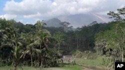 Indonesia's Mount Merapi looms over the surrounding villages. Even on a clear day the smoke that shoots from its summit is intimidating, 01 Nov. 2010.