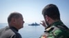 FILE - German Chancellor Olaf Scholz observes maneuvers in the Baltic Sea during his visit to the German Navy in Rostock-Warnemunde on June 5, 2023.