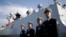 FILE - Chinese Navy officials stand in front of the ship Daqing.