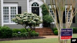 FILE - A campaign sign for Republican congressional candidate Dave Brat is posted in front of his home in Glen Allen, Virginia, June 12, 2014. Brat defeated House Majority Leader Eric Cantor in that year's Republican primary. 