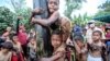 Children take part in a greased-pole climbing competition during the celebration of the 75th anniversary of the country&#39;s independence in Medan, North Sumatra, Indonesia.