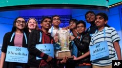 The eight co-champions of the 2019 Scripps National Spelling Bee, from left, Shruthika Padhy, 13, of Cherry Hill, N.J., Erin Howard, 14, of Huntsville, Ala., Rishik Gandhasri, 13, of San Jose, Calif., Christopher Serrao, 13, of Whitehouse Station, N.J., S