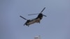 A U.S. Chinook helicopter flies over Kabul, Afghanistan, Aug. 15, 2021.