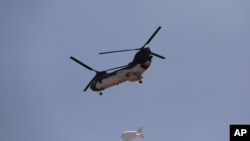 A U.S. Chinook helicopter flies over Kabul, Afghanistan, Aug. 15, 2021.