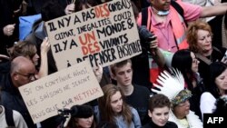 Climate activists Adelaide Charlier (C) and Anuna De Wever (3rd R) march with protesters during a demonstration against climate change, in Brussels, Oct. 10, 2021.