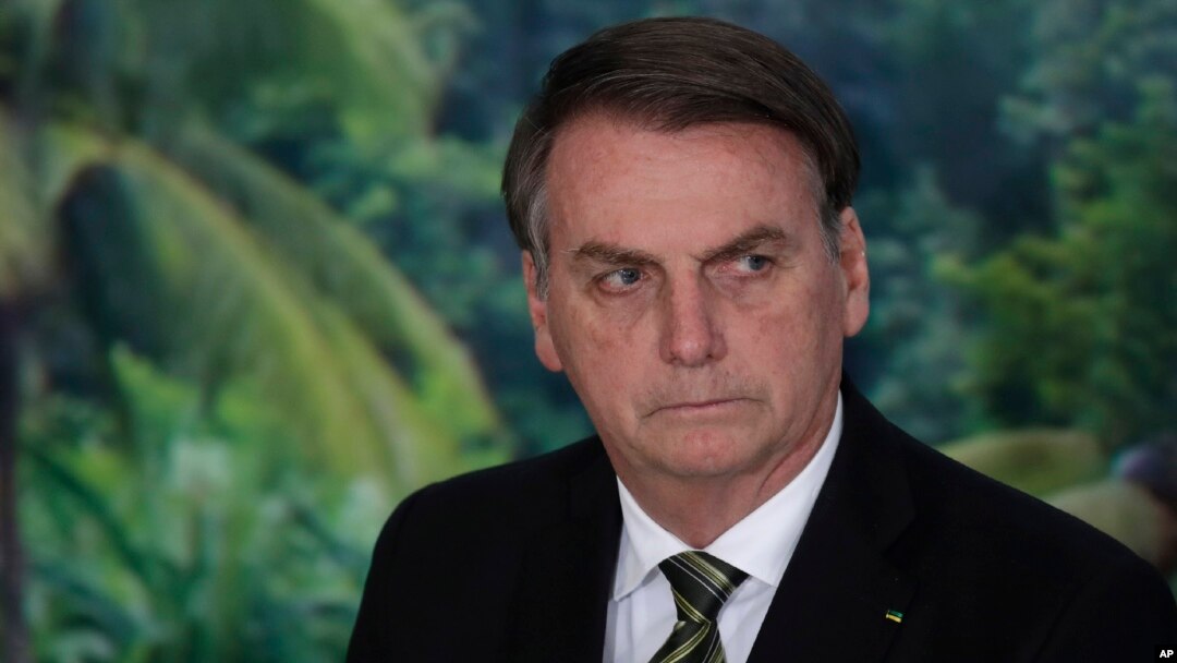 FILE - President Jair Bolsonaro attends a ceremony at the Planalto presidential palace in Brasilia, Brazil, Oct. 1, 2019.