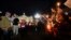 People hold candles as they attend a prayer vigil for terminally ill toddler Alfie Evans, in St. Peter's Square at the Vatican, Thursday, April 26, 2018.