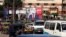 People and vehicles are seen near a poster of Egypt's President Abdel-Fattah el-Sissi for the upcoming presidential election, which reads, "Yes, All of us with you for Egypt," in Cairo, Feb. 28, 2018. 