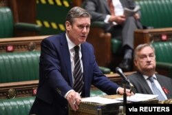 FILE - Britain's opposition Labor Party leader Keir Starmer speaks in the House of Commons in London, Dec. 2, 2020.