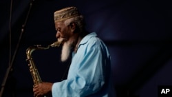 FILE - Jazz saxophonist Pharaoh Sanders performs at the New Orleans Jazz and Heritage Festival in New Orleans, Friday, May 2, 2014.