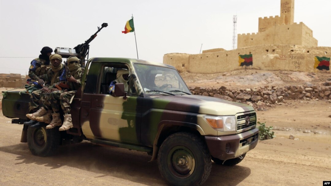 FILE - This file picture dated July 29, 2013 shows Malian soldiers patrolling in Kidal, northern Mali. 