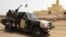 FILE - This file picture dated July 29, 2013, shows Malian soldiers patrolling in Kidal, northern Mali. 