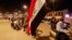 Iraqi protesters demonstrate against Iraq's parliament after it approved amendments to the elections law, in Najaf, Iraq March 27, 2023. 