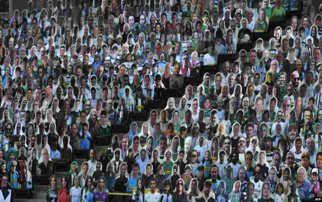 Cardboard cut-outs with portraits of Borussia Monchegladbach&#39;s supporters are seen at the Borussia Park soccer stadium in Monchengladbach, Germany, amid the COVID-19 pandemic.