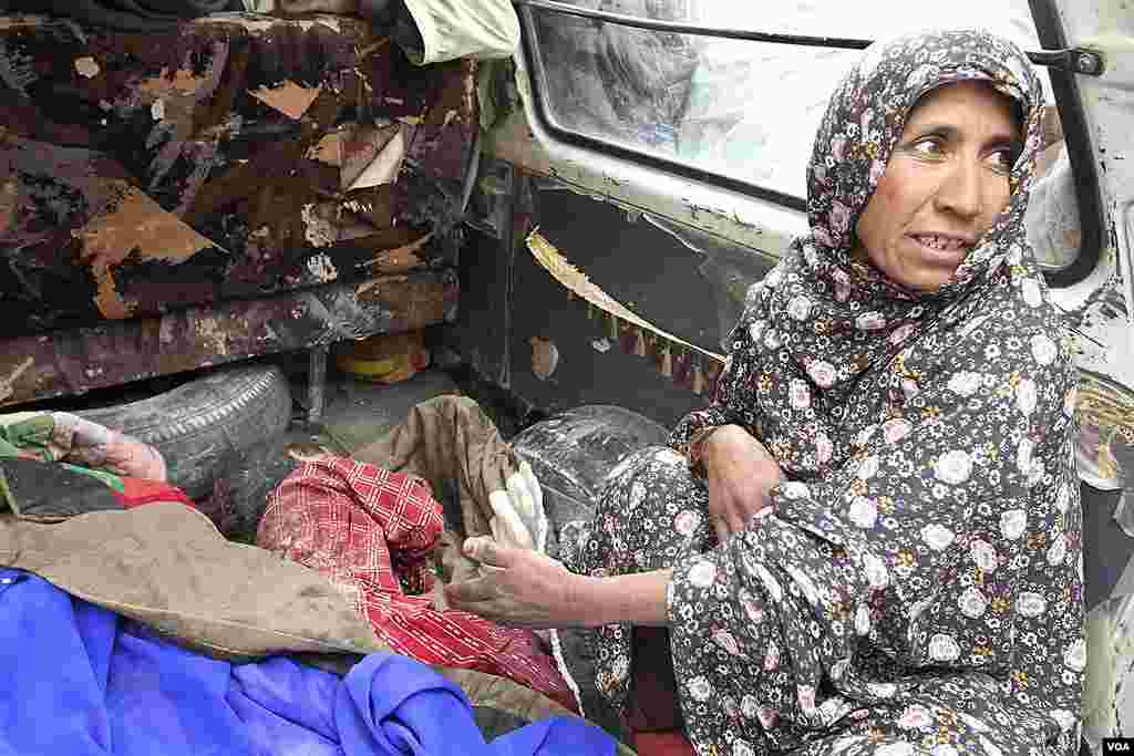 Anar Gul gestures to the body of her grandchild, who was allegedly killed by a U.S. service member in Panjwai, Kandahar province south of Kabul, Afghanistan, March. 11, 2012. (AP) 