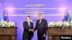 Serokê Rêxistina Enerjîya Atomê ya Îranê Mihemed Îslamî û , serokê Ajansa Navneteweyî ya Enerjîya Atomê (IAEA) Rafael Grossî, li bajarê Îsfehan yê Îranê, 7 Gulan, 2024.