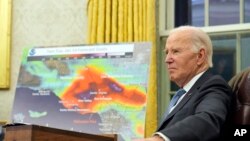 President Joe Biden listens during a meeting with senior officials as he is briefed on the federal response to the wildfires across Los Angeles, during a meeting in the Oval Office of the White House, in Washington, Jan. 13, 2025.