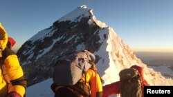 FILE - Climbers make their way to the summit of Everest, Nepal May 22, 2019. (REUTERS/Phurba Tenjing Sherpa)