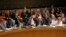 Members of the Security Council vote in favor of putting North Korea's human rights situation on the council's agenda during a meeting on Monday, Dec. 22, 2014.
