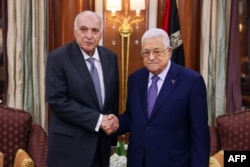 FILE —This photo provided by the Palestinian Authority's press office shows Palestinian president Mahmud Abbas (R) meeting with Algeria's Foreign Minister Ahmed Attaf in Riyadh on April 27, 2024.