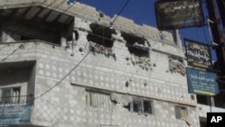 A view of houses that residents said were damaged during a military crackdown on protesters against Syrian President Bashar al-Assad, is seen in Rasten near Homs, February 3, 2012.