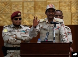 Sudanese Gen. Mohammed Hamdan Dagalo, the deputy head of the military council, speaks during a rally to support the new military council that assumed power in Sudan after the overthrow of President Omar al-Bashir, in Khartoum, Sudan, June 16, 2019.